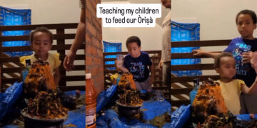 Video Of oyibo man teaching his children on how to feed their juju
