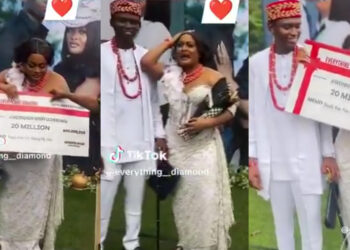 Heartwarming Surprise: Husband Gifts Wife ₦20 Million Cheque at Traditional Wedding