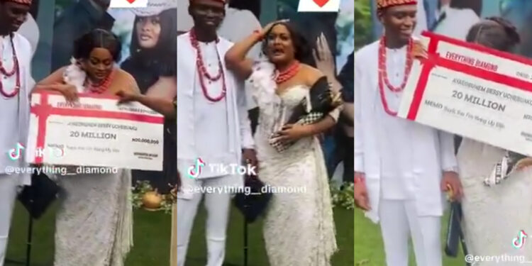 Heartwarming Surprise: Husband Gifts Wife ₦20 Million Cheque at Traditional Wedding