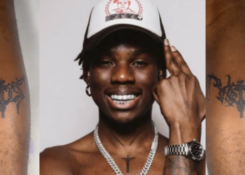 A true hard Fan of Rema Gets his Album Symbol Tattooed on His Leg: A True Show of Loyalty!