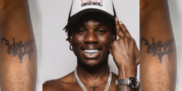 A true hard Fan of Rema Gets his Album Symbol Tattooed on His Leg: A True Show of Loyalty!