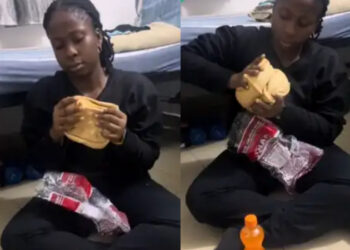 “Aproko Doctor Is Setting His Ring Light”- Nigerians React As Lady Is Caught Eating Big Bread At 2am