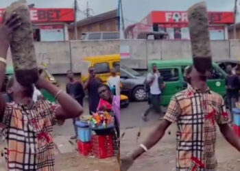 “Unbelievable Feat: Lagos Man Stuns Ikeja Crowd by Lifting Heavy Stone with His Mouth”