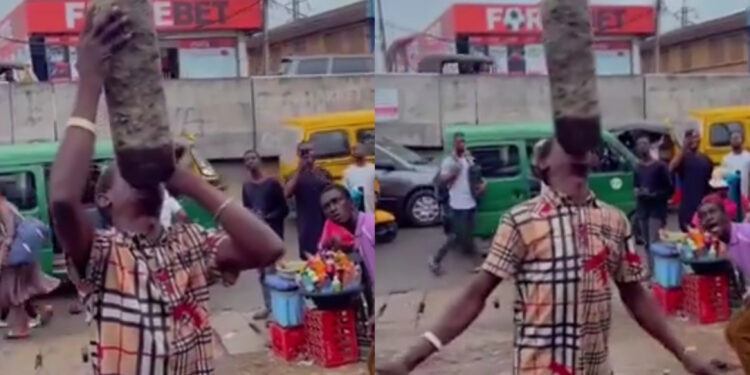 “Unbelievable Feat: Lagos Man Stuns Ikeja Crowd by Lifting Heavy Stone with His Mouth”