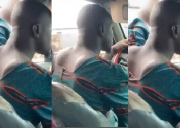 A Nigerian driver stir reactions  as he is seen wearing a woman’s blouse while doing his driving work 