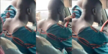 A Nigerian driver stir reactions as he is seen wearing a woman’s blouse while doing his driving work
