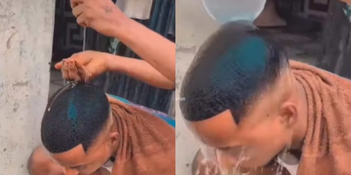 Nigerian barber is seen using egg to wash the head of his client after giving him amazing haircut
