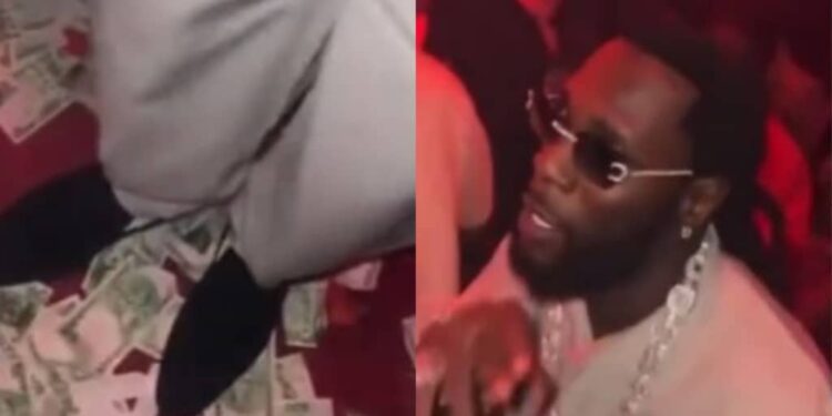 Video of Burna Boy stepping on Naira notes while dancing at a nightclub got viral on the internet
