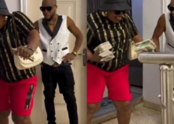Charles Okocha’s mom mad Nigerians laugh with her joyful reactions after actor sprays her bundles of Naira notes