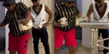 Charles Okocha’s mom mad Nigerians laugh with her joyful reactions after actor sprays her bundles of Naira notes