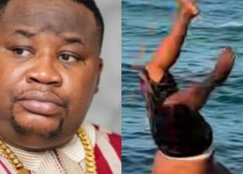 “Happiness is free”- Reactions as Cubana Chief Priest is spotted on the beach enjoying himself