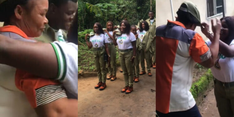 corps members shows appreciation to a woman for providing them with water during their service year in Akwa Ibom state 