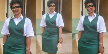 57 years old Lady,raised eyebrows as she dresses up in uniform as she attends her secondary school’s 40th reunion