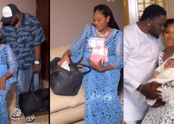 Man celebrates his wife with bag of millions of naira just for the stress she went through labour as they welcome their first child. 