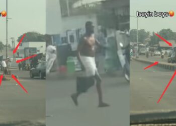 “Na prank or ritu@list”- Reactions as Man Takes Bath in Middle of Public Road