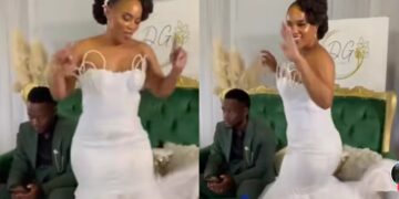 “Bro looks shy and exhausted from the ups and down”-Netizens react as groom ignores bride, focuses on phone during wedding